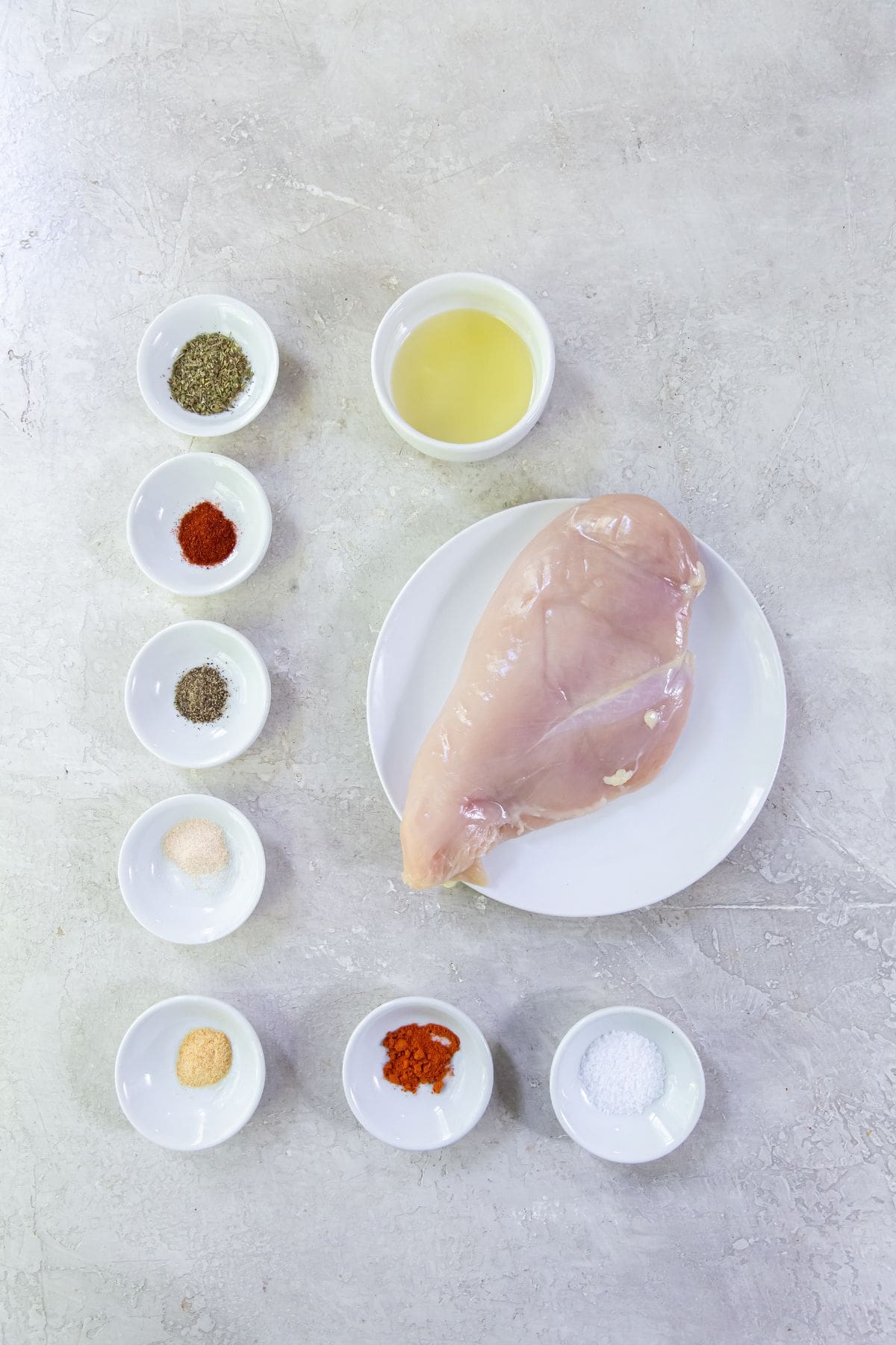 ingredient photo for blacken chicken. Seasonings (salt, pepper, paprika, onion, garlic, cayenne, Italian seasoning) Avocado oil