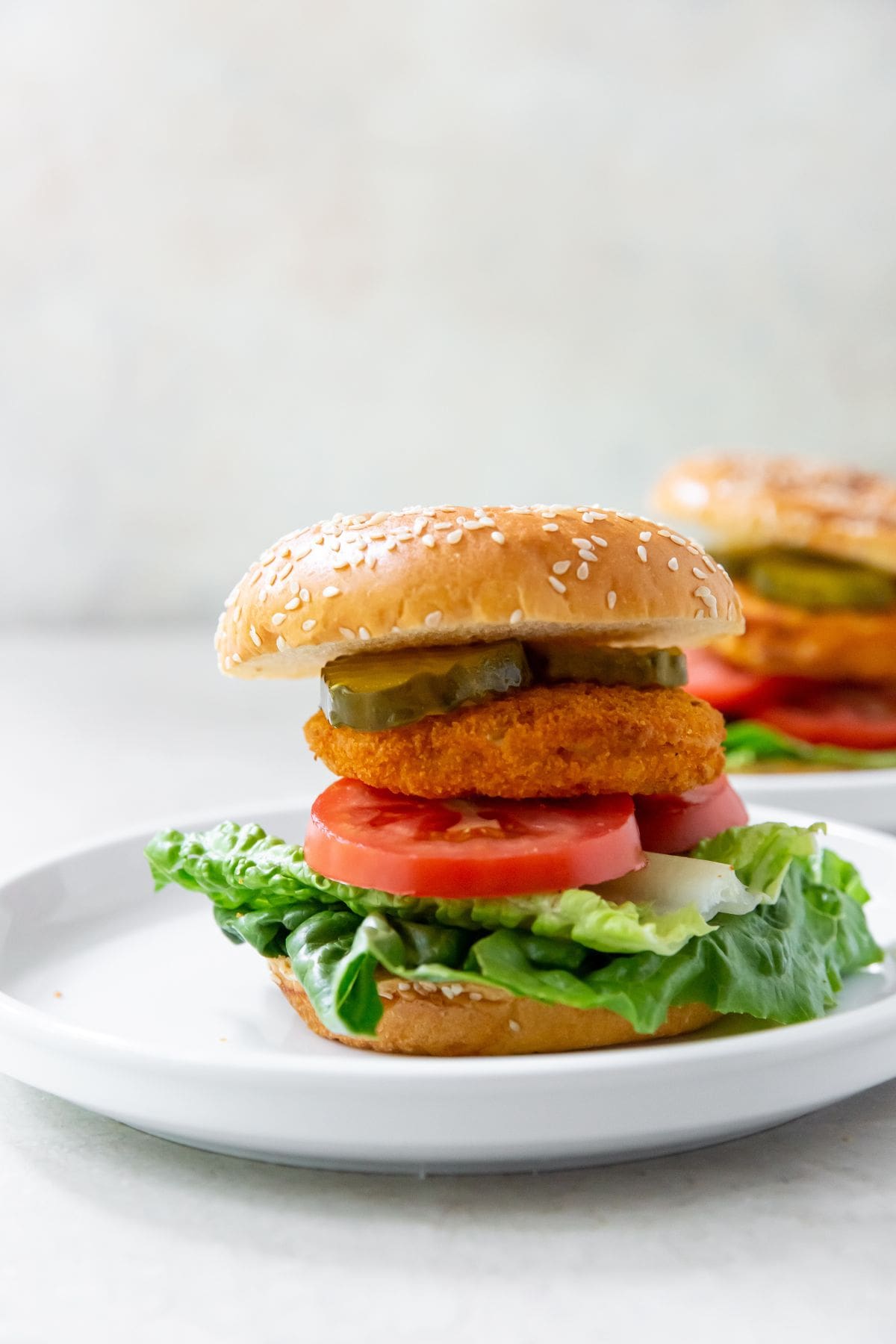 white plate with chicken patty on it