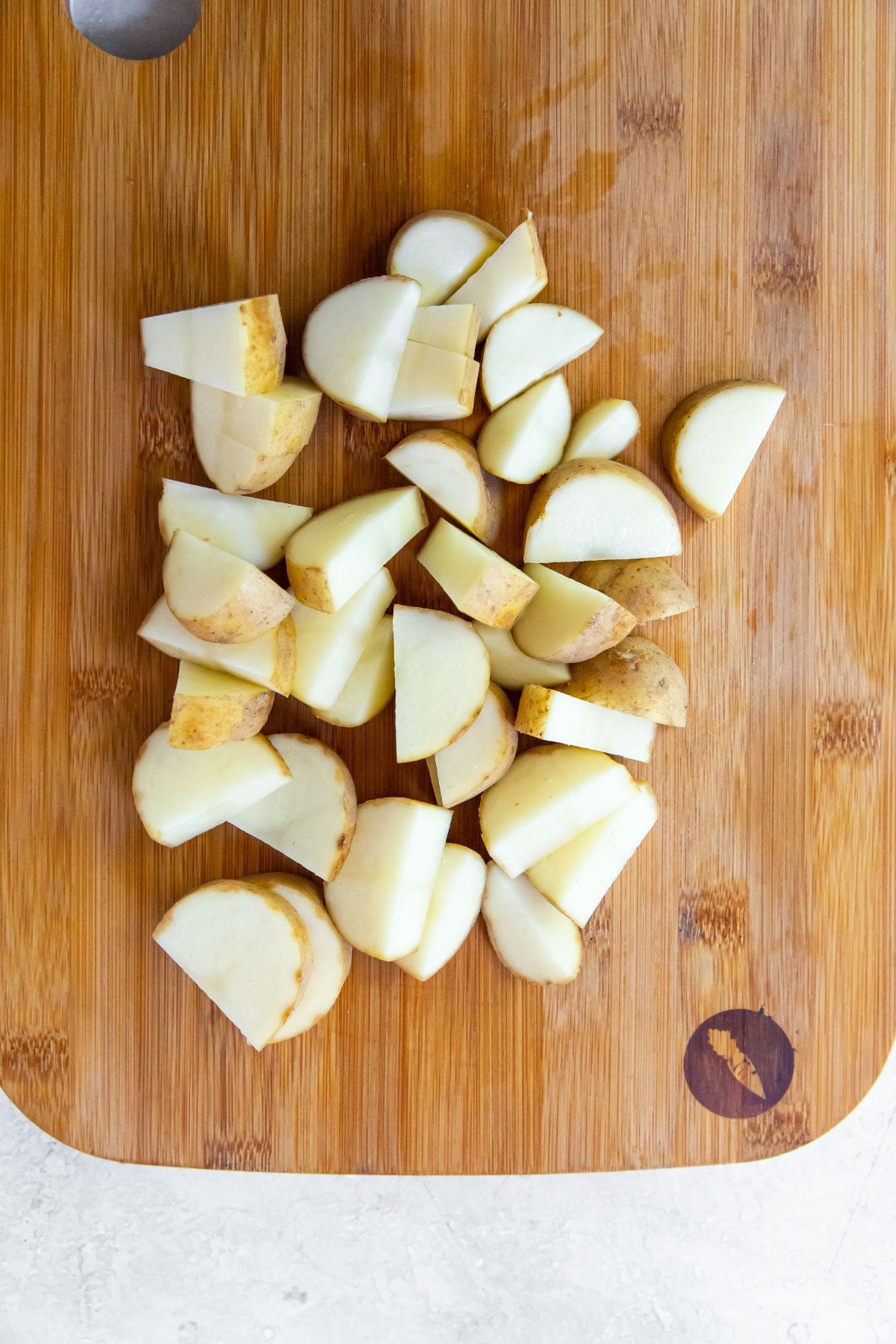 potatoes cut up on a cutting board