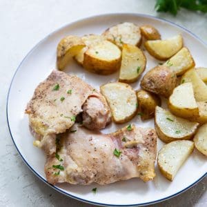 plateful of chicken thighs and potatoes