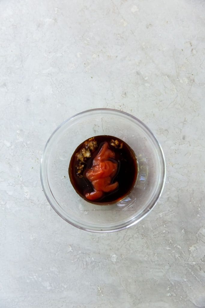 glass mixing bowl with katsu ingredients inside it