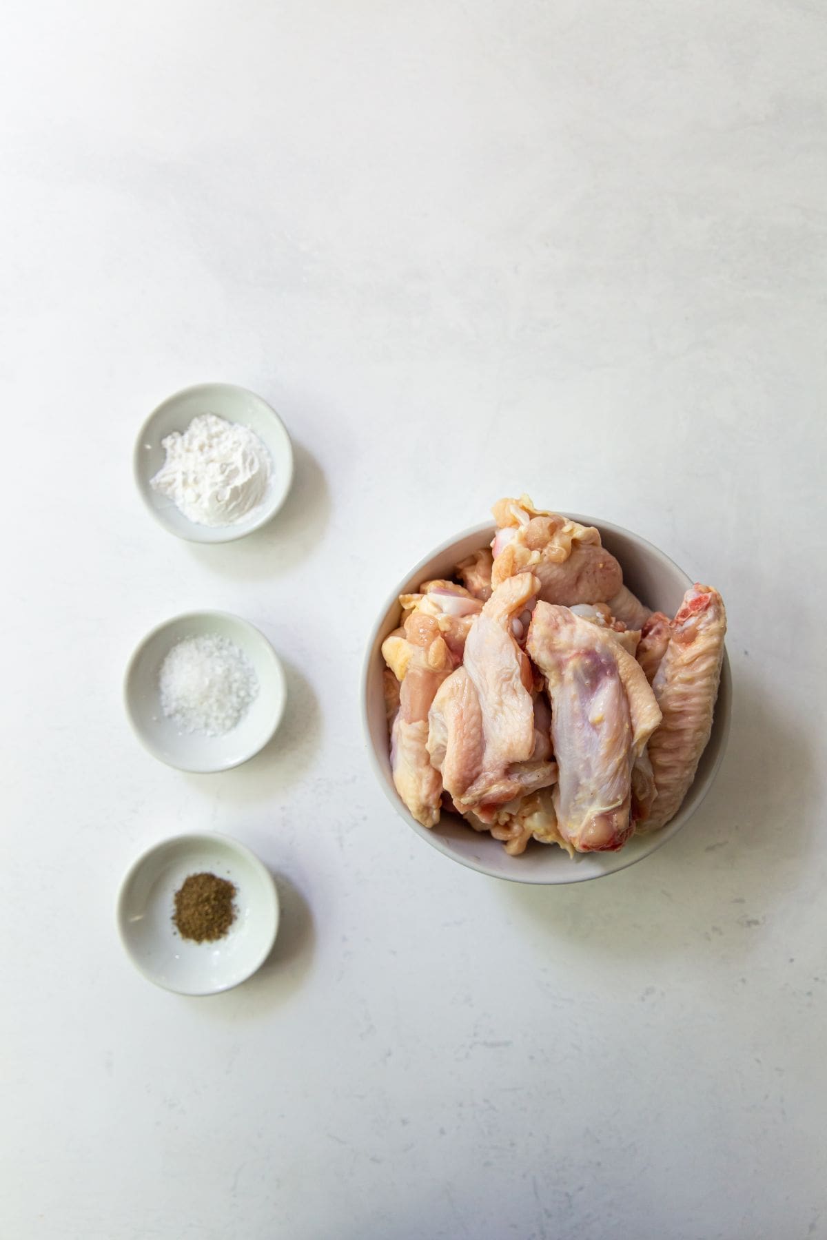 ingredient photo. chicken wings salt black pepper and baking soda