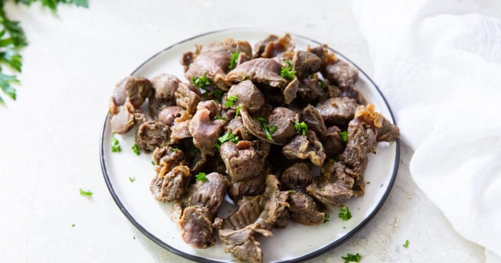 cooked air fryer chicken gizzards without flour on a white plate