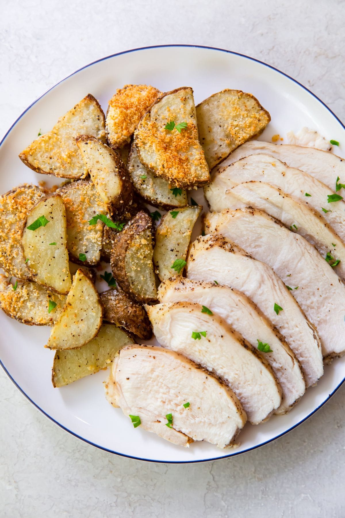 plate full of cut up chicken breast and potatoes