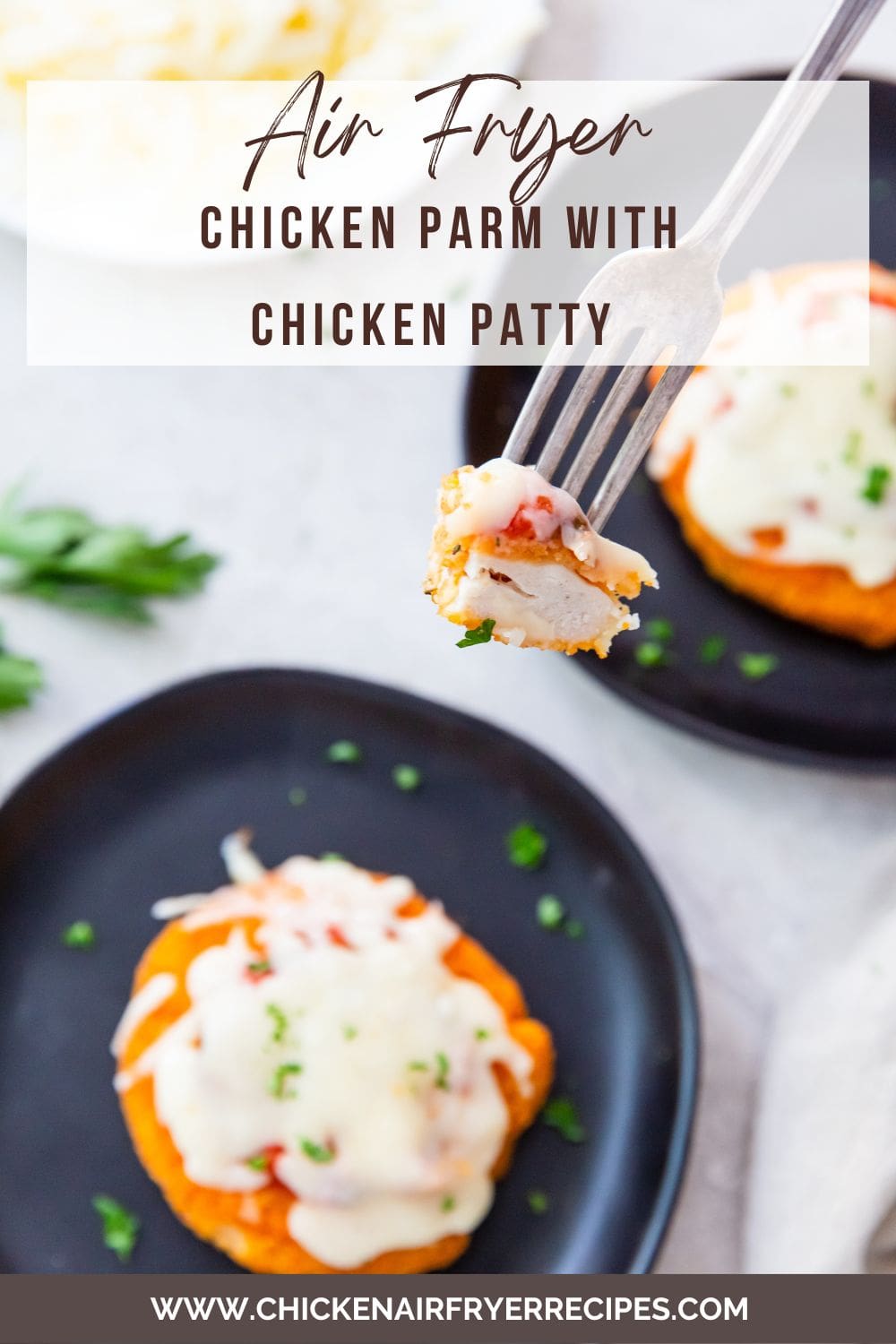 black plates with chicken patties on it a piece being held over the plate with a fork