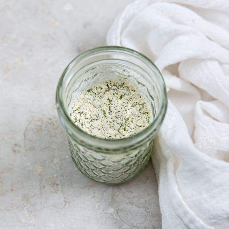 mason jar with ranch seasoning white towel next to it