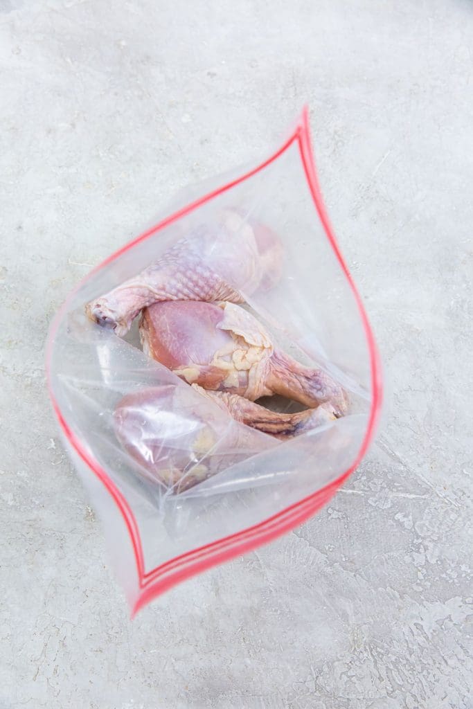 ziplock bag with chicken legs inside