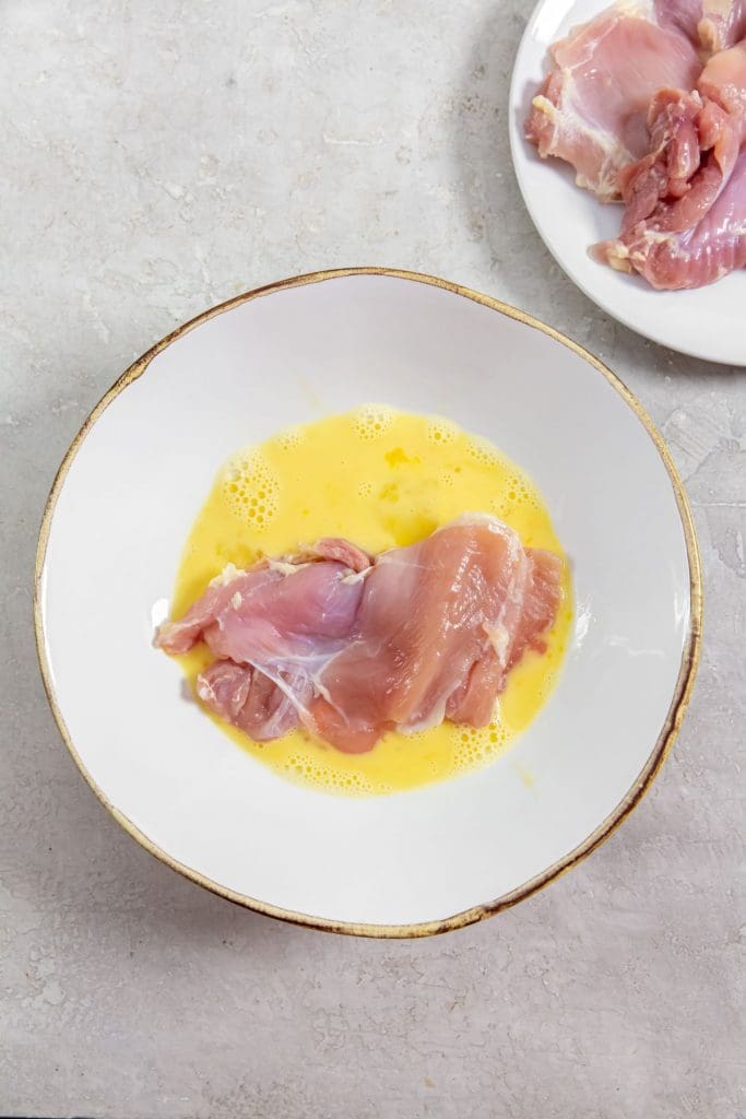 glass bowl with chicken in the egg bath