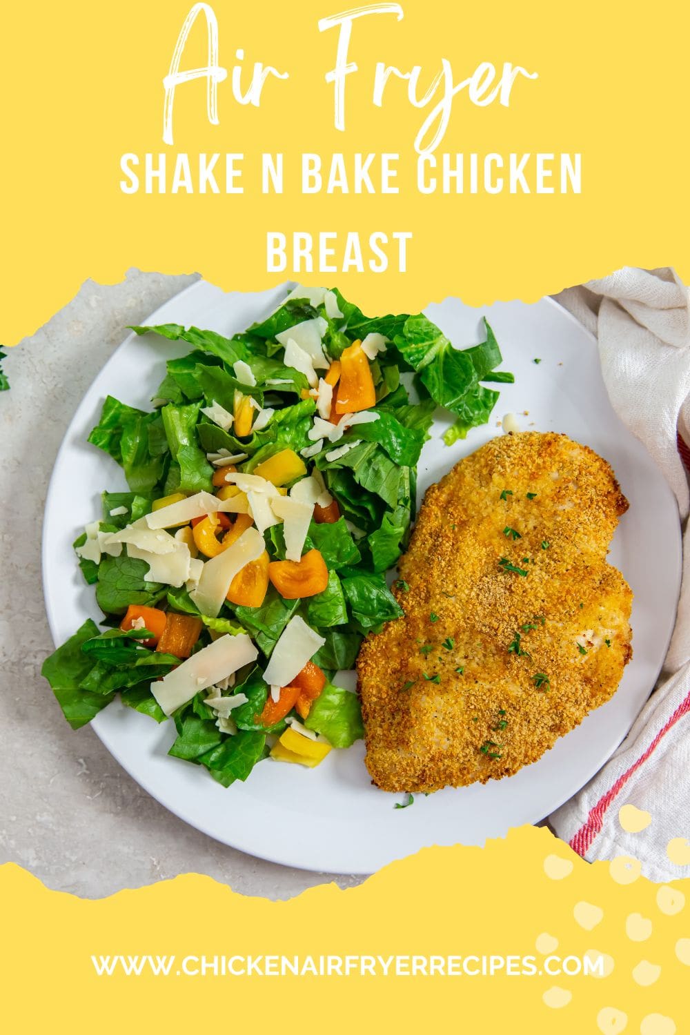 white plate with chicken and salad on plate parsley and pink towel in the back