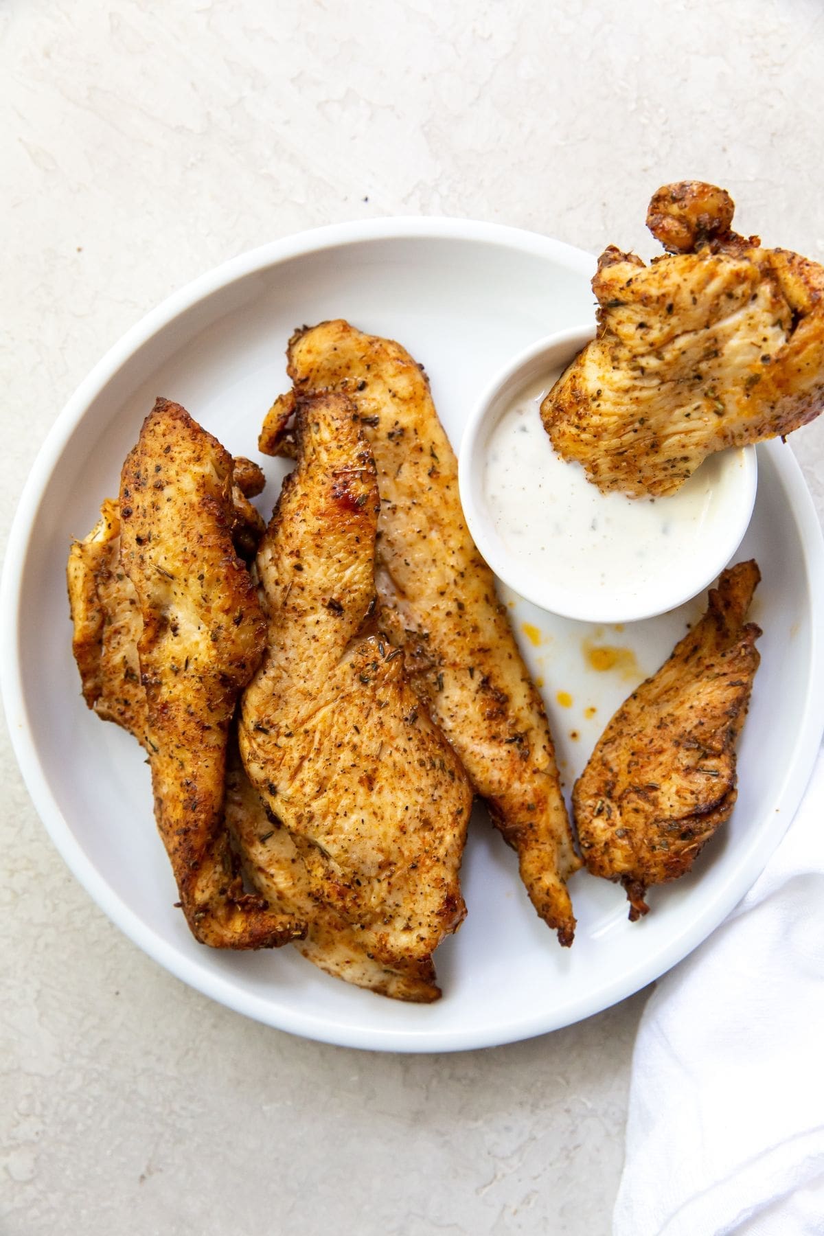 The Best Air Fryer Chicken Breast Recipes a Plate of Air Fryer Chicken Breast Strips with Ranch Dressing