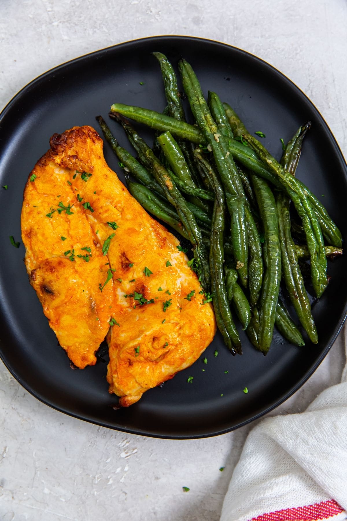 The Best Air Fryer Chicken Breast Recipes Close Up of a Plate of Air Fryer Buffalo Chicken Breast with Green Beans