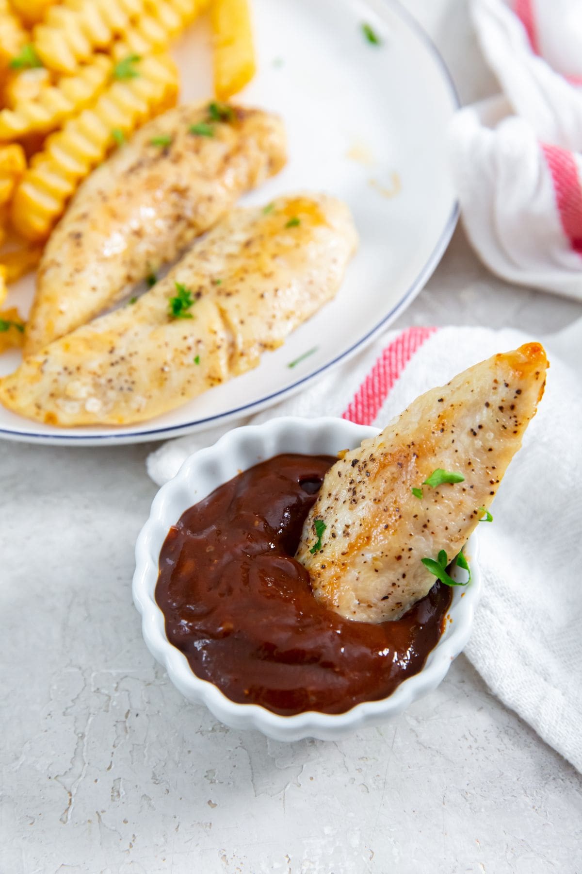 chicken dunked in bbq sauce