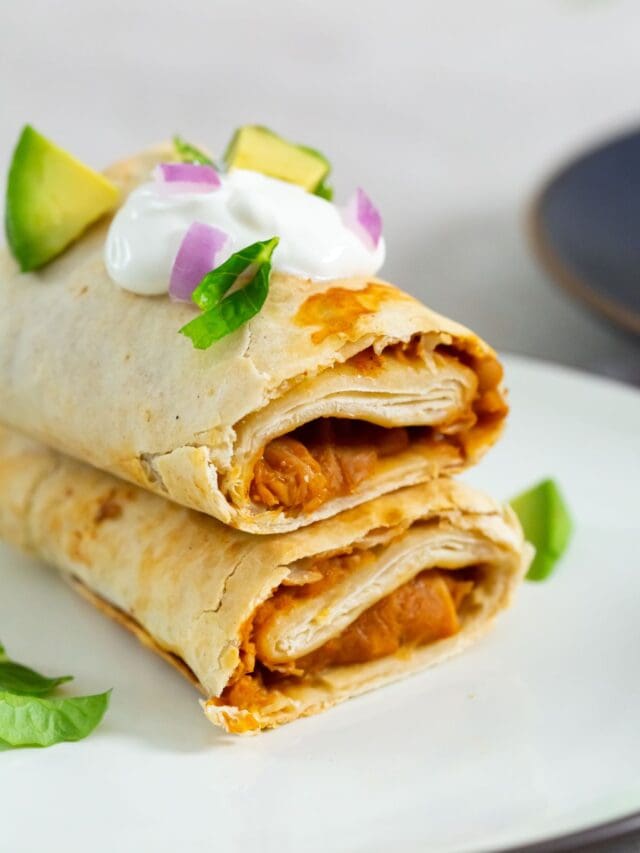 burrito with sour cream avocado and lettuce