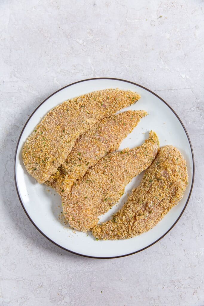 white plate with chicken breaded chicken