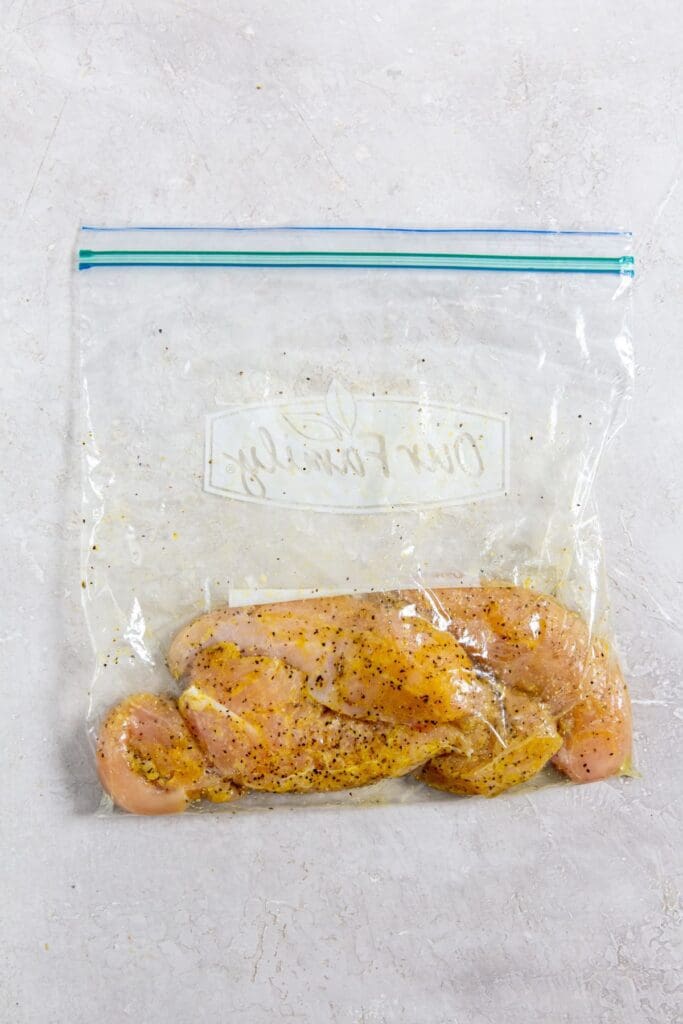 ziplock bag with seasoned chicken inside