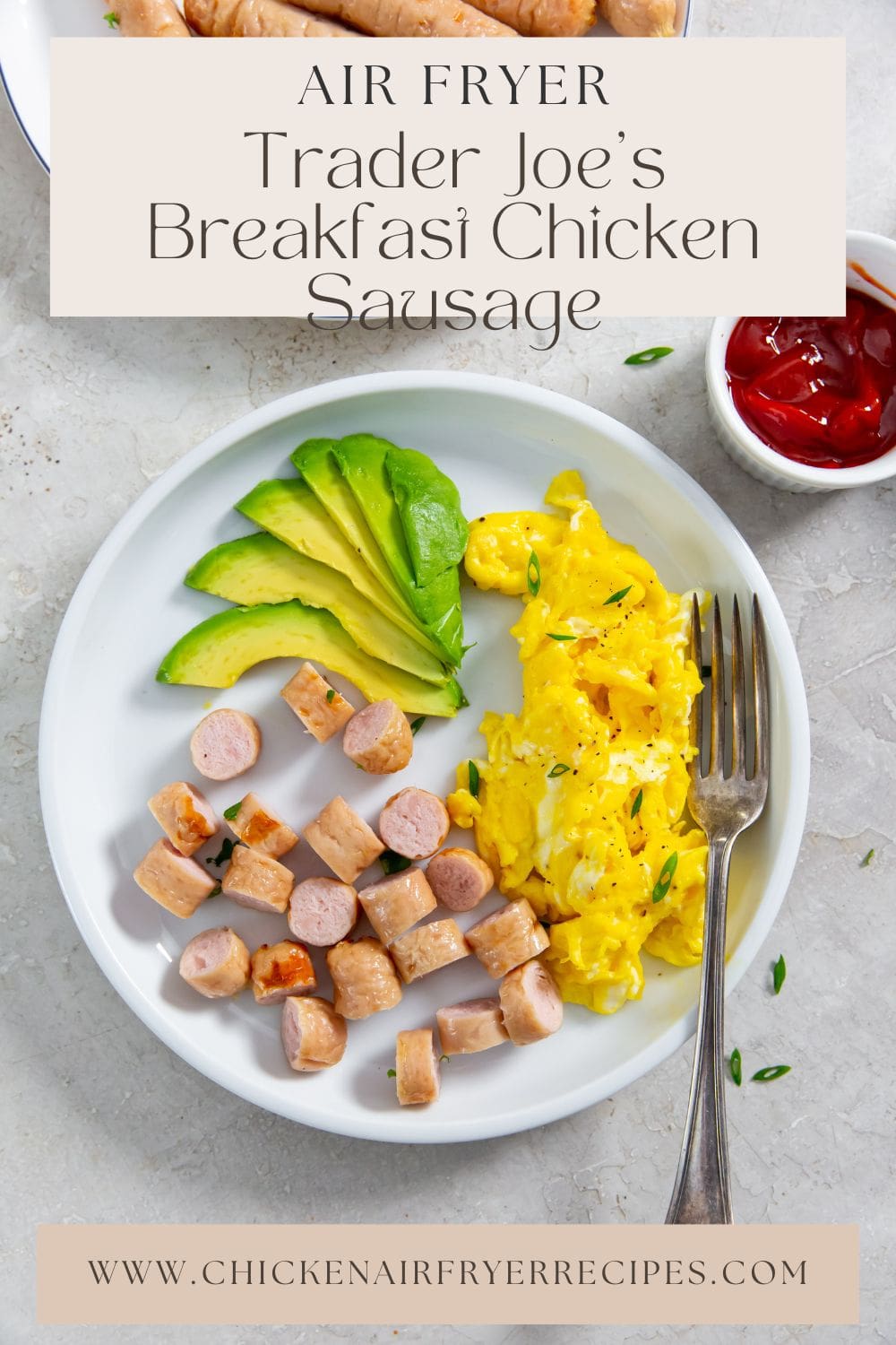 plate with sausage, eggs, and avocado slices.