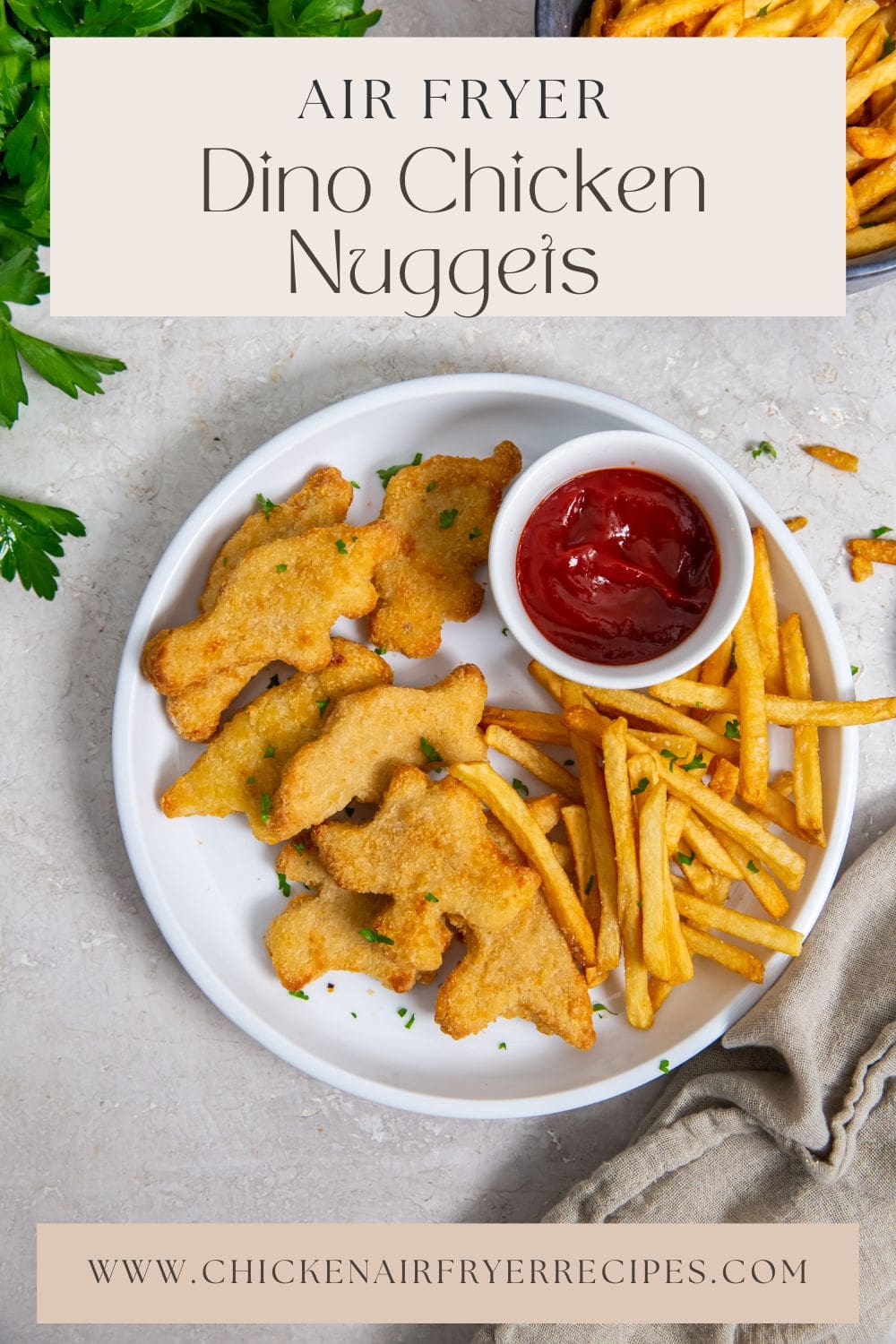 white plate with chicken fries and ketchup. parsley and gray towel in the back