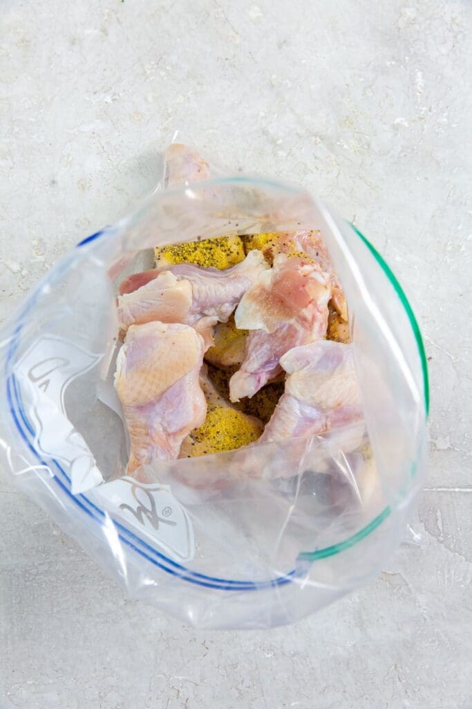 ziplock bag with chicken and seasoning