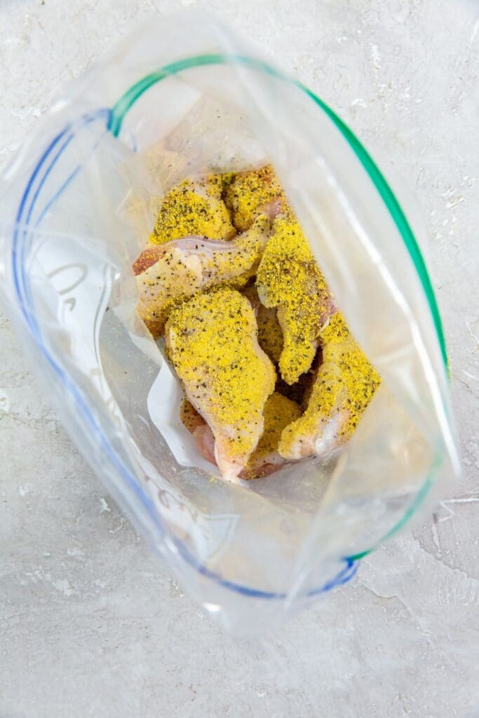 ziplock bag with chicken and seasoning