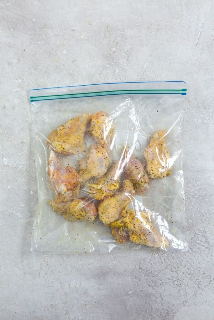 ziplock bag with chicken and seasoning