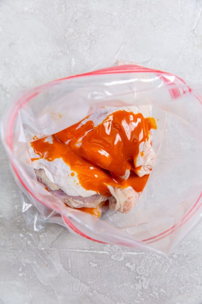 ziplock bag with chicken and sauce inside