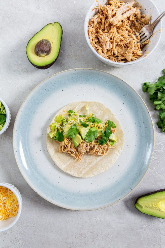 blue plate with taco on it.