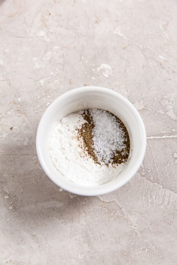 small mixing bowl with dry ingredients inside