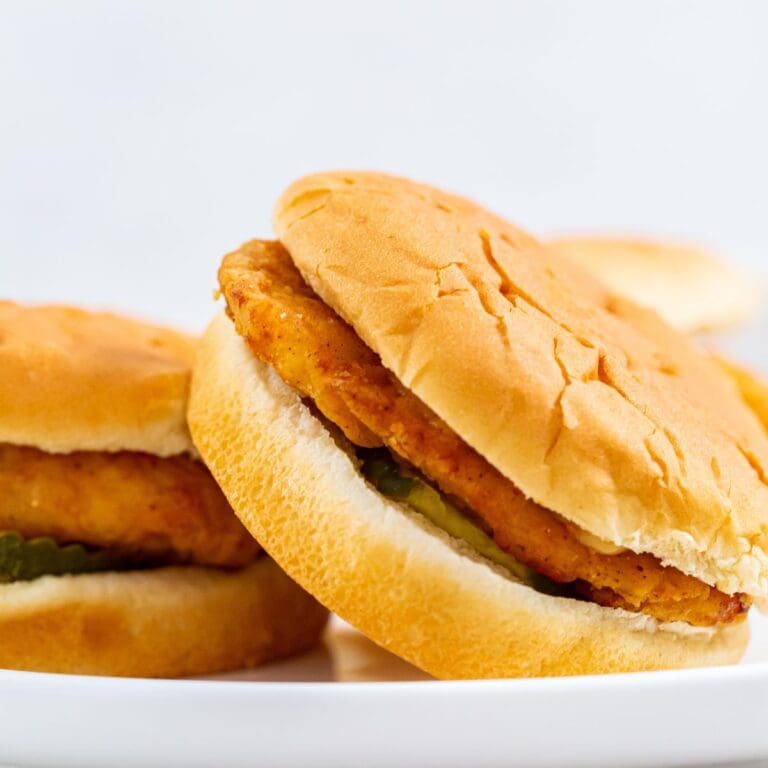 A plate with two copycat Chick-fil-A sandwiches.