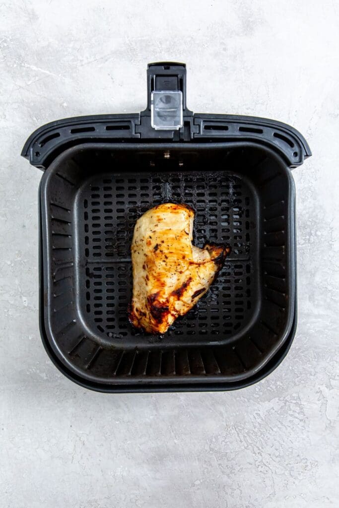 An Italian chicken breast cooked in an air fryer.