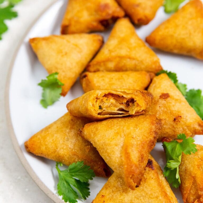 Air Fryer Mini Chicken Tikka Samosas on a white plate.