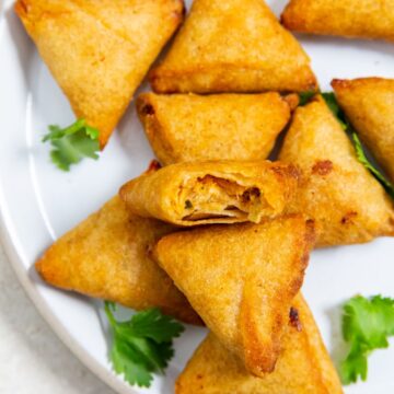 Chicken Tikka Samosas served on a white plate.