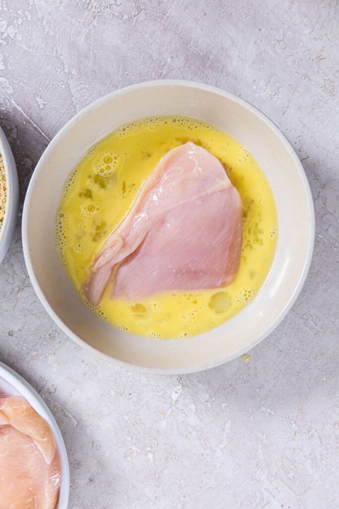 Air Fryer Chicken Cutlets egg wash and chicken inside