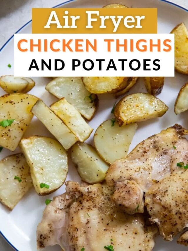 Air fryer chicken thighs and potatoes recipe served on a plate, garnished with herbs.