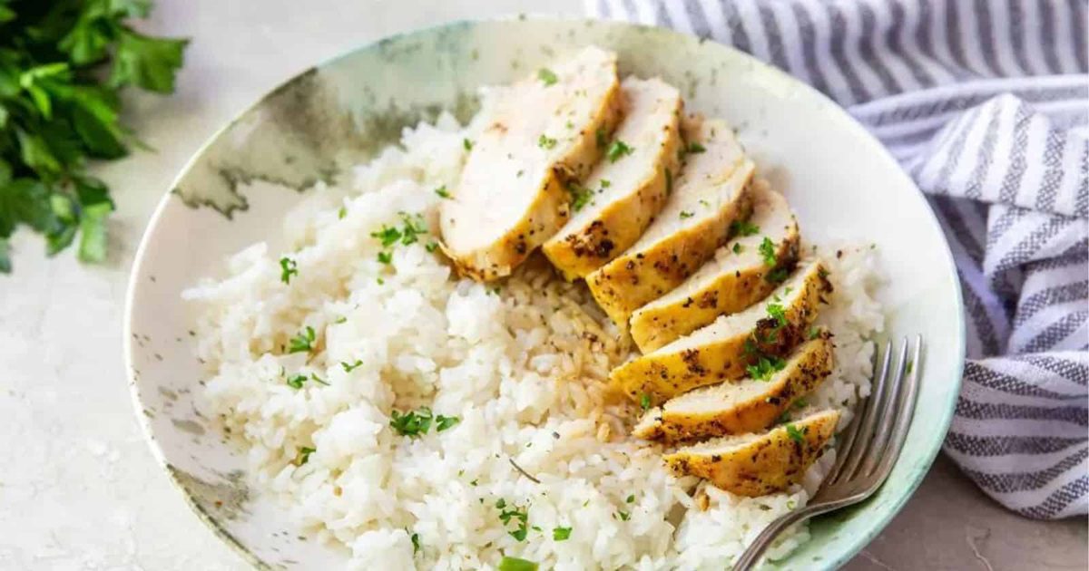 Air-Fried Chicken Dishes Sliced Air Fryer Lemon Pepper Chicken Breast on Rice in a Bowl