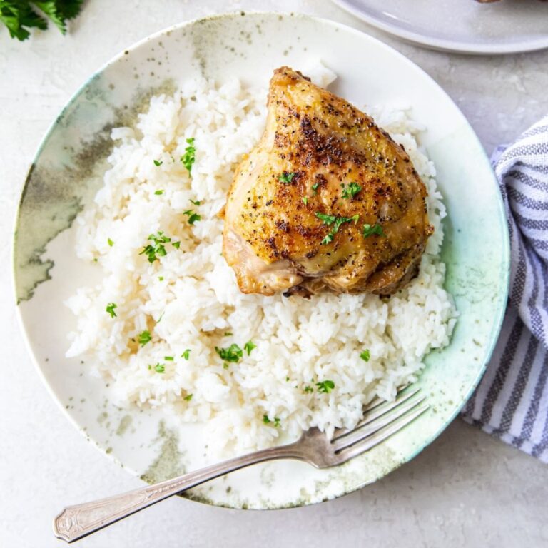Air-Fried Chicken Dishes Overhead View of a White Plate with Chicken and Rice and a Fork