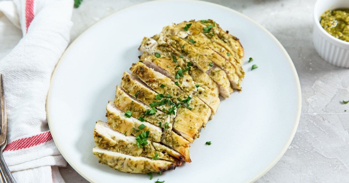 Air Fryer Recipes Sliced Easy Air Fryer Pesto Chicken Breast on a Plate