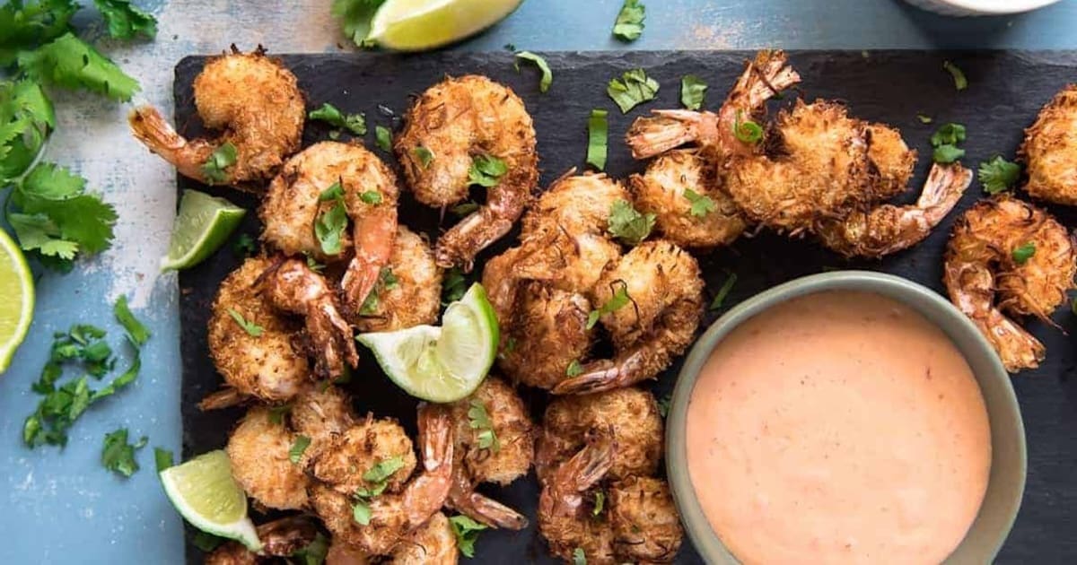 Air Fryer Recipes a Plate of Crunchy Air Fryer Coconut Shrimp with a Ramekin of Dipping Sauce