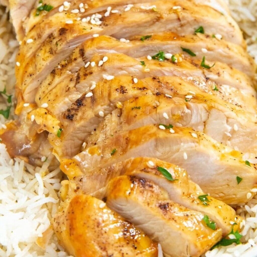 Chicken Air Fryer Recipes for Your Craziest Days Close Up of Sliced Chicken On Top of a Bowl of Rice