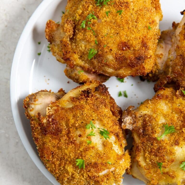 Chicken Thigh Air Fryer Recipes Close Up of a Plate of Shake and Bake Chicken Thighs