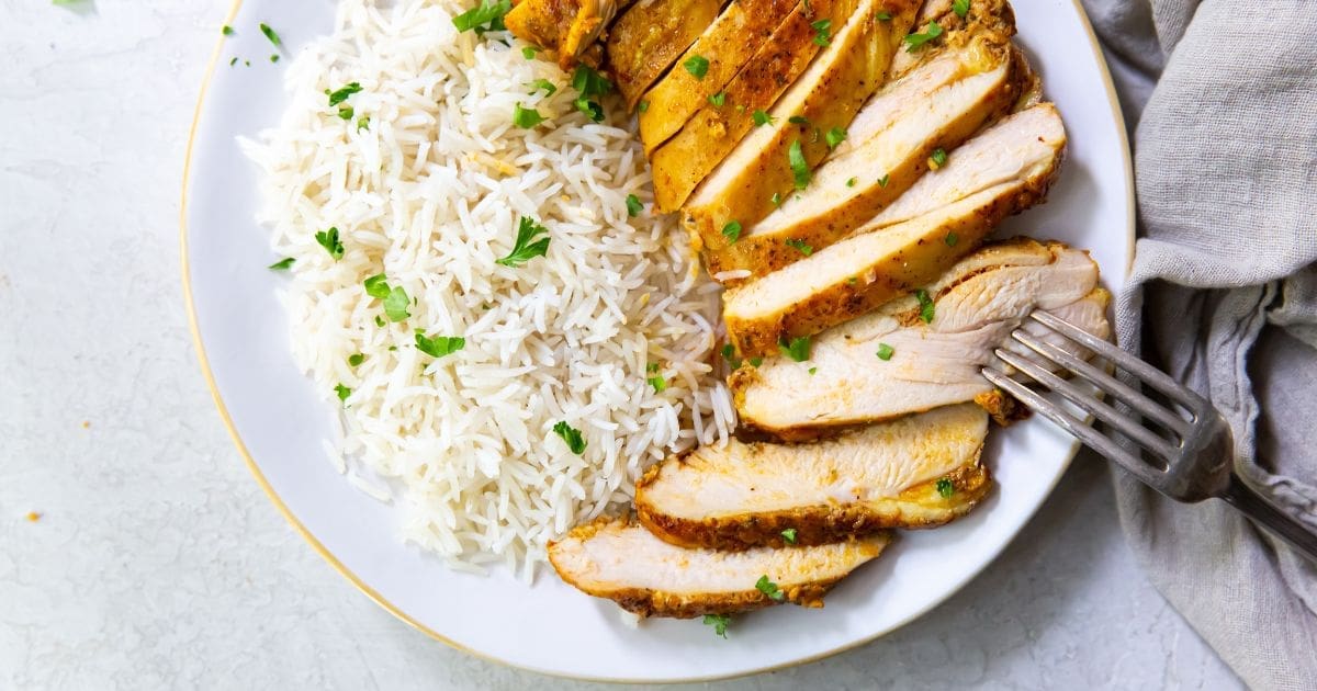 Air Fryer Dinners Close Up of a Plate of Rice and Trader Joe's Shawarma Chicken Thighs in the Air Fryer