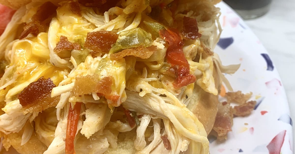 20 Easy Dinners My Family Claims Are Restaurant-Quality Close Up of Crockpot Shredded Chicken Sandwiches