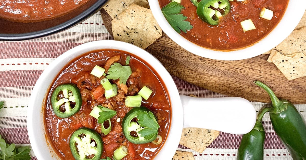 Midweek Meal Plan Overhead View of Two Bowls of Chili Topped with Jalapenos and Green Onions