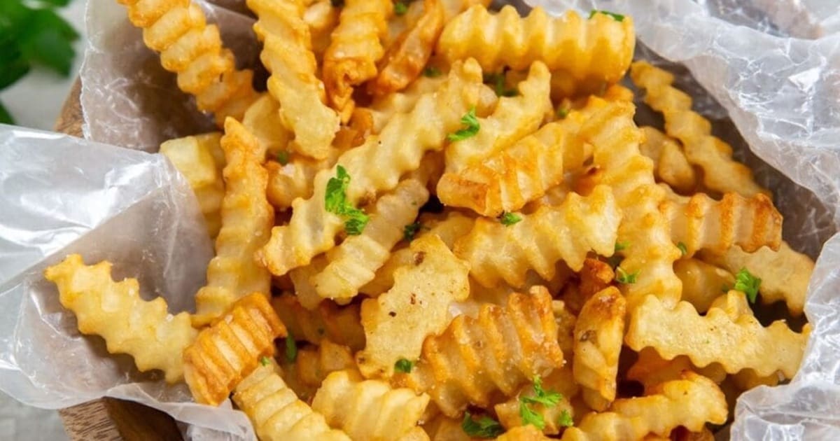 Mouthwatering Sides Close Up of Air Fryer Crinkle Cut French Fries in a Basket