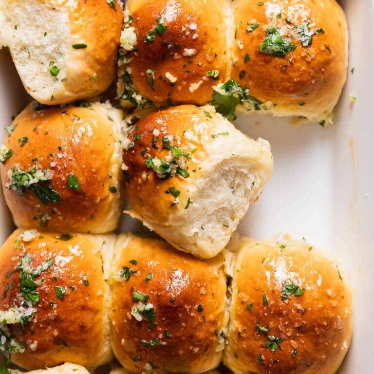 Mouthwatering Sides Bread Rolls Covered in Butter and Garlic on a Baking Sheet