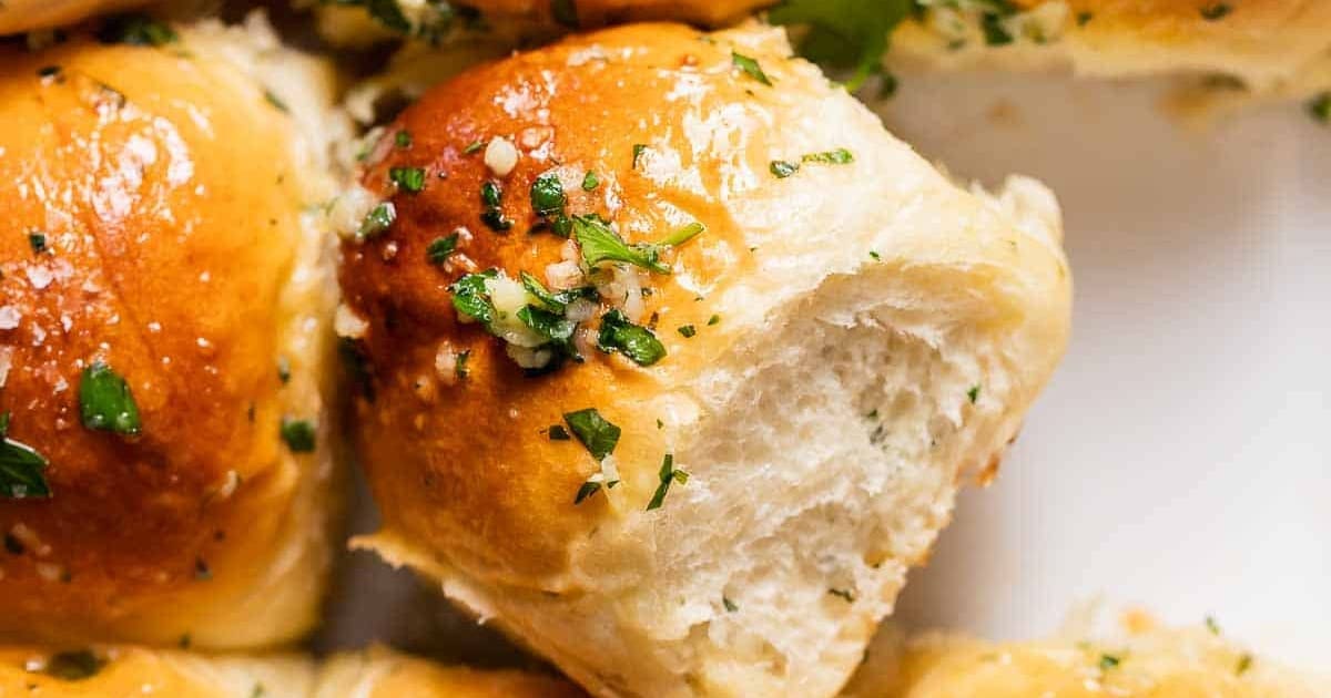 Mouthwatering Sides Close Up of a Tray Filled with Garlic Bread Rolls