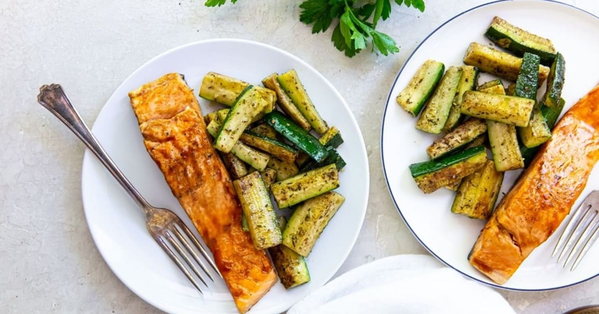 Recipes We Make Two plates of Salmon on the Blackstone Griddle with Steamed Zucchini