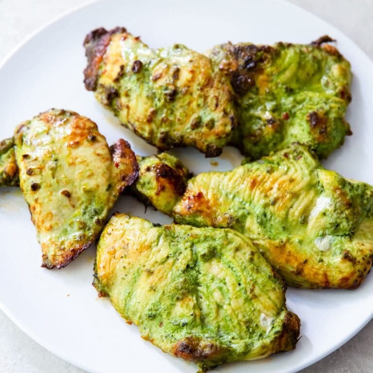 Tasty Dinners You Can Whip Up Without Breaking a Sweat Close Up of a Plate of Pesto Chicken Thighs