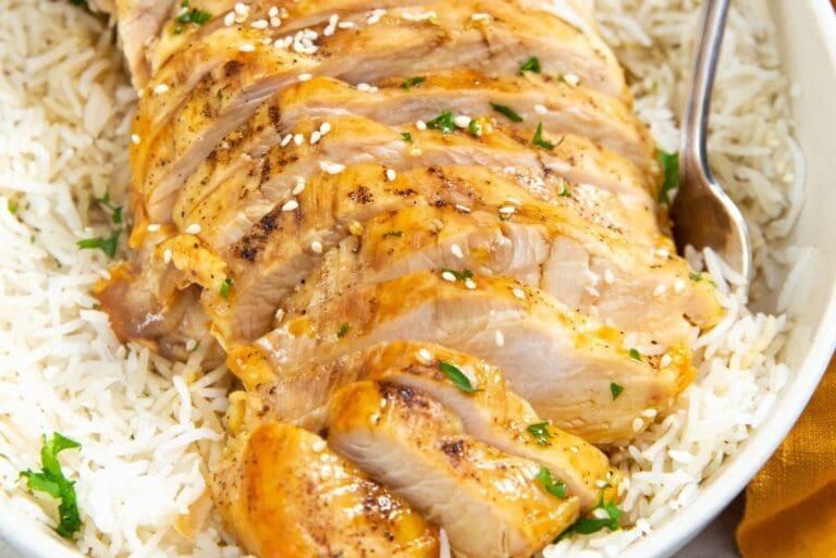 Air Fryer Chicken Recipes Close Up of Sliced Chicken Breast on a Bowl of Rice