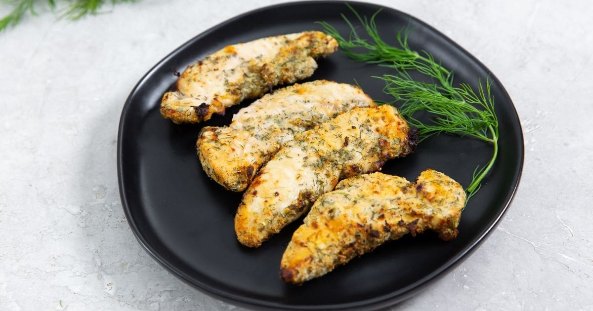 Easy Air Fryer Ranch Chicken Tenders Close Up of a Black Plate with Chicken Tenders on it