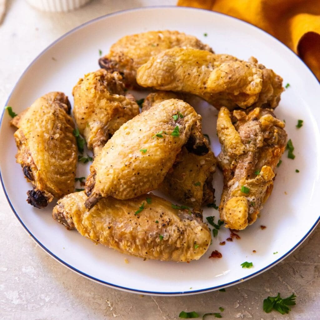 16 Air Fryer Chicken Recipes Close Up of a Plate of Cooked Chicken Wings